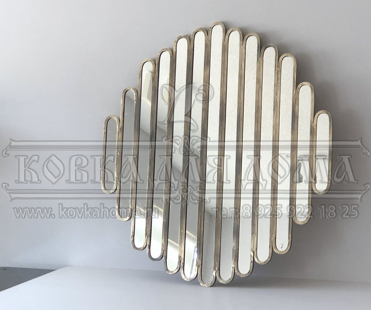 Зеркало необычной формы в уникальной стальной дизайнерской раме, настенное ручной работы. Размер габаритный D=500мм.